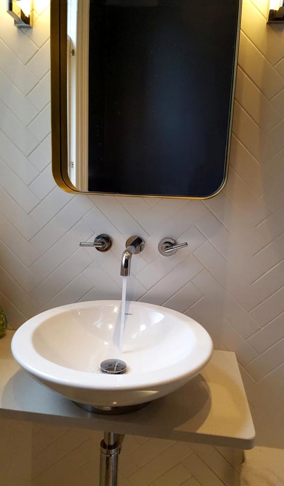 Herringbone tile design for an en-suite bathroom in Stockbridge.